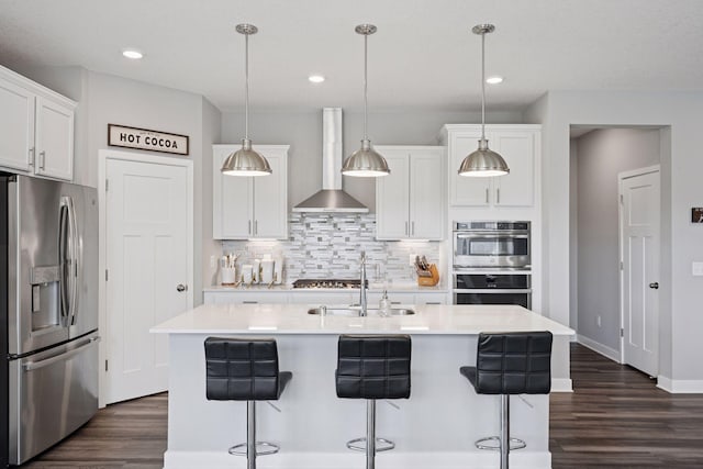 14660 109th Ave N, Maple Grove, MN 55369 - kitchen with appliances with stainless steel finishes, wall chimney exhaust hood, decorative backsplash, dark wood-type flooring, and light countertops