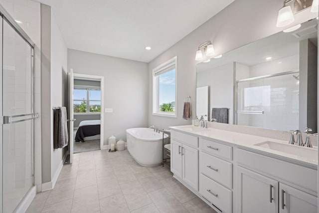 14660 109th Ave N, Maple Grove, MN 55369 - full bath featuring double vanity, a shower stall, a freestanding tub, recessed lighting, and connected bathroom