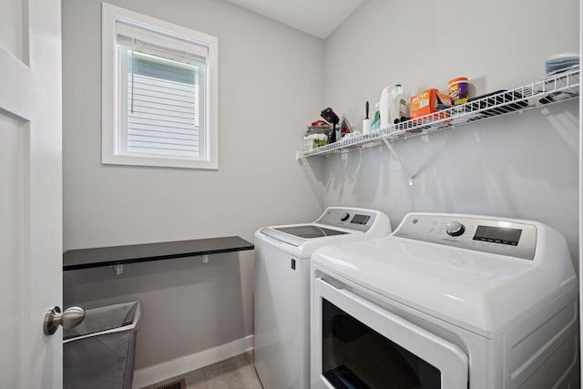 14660 109th Ave N, Maple Grove, MN 55369 - washroom featuring washing machine and dryer and light tile patterned floors