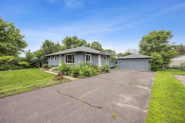 12209 Davenport St NE, Blaine, MN 55449 - view of front facade with a detached garage, a front yard, and an outdoor structure