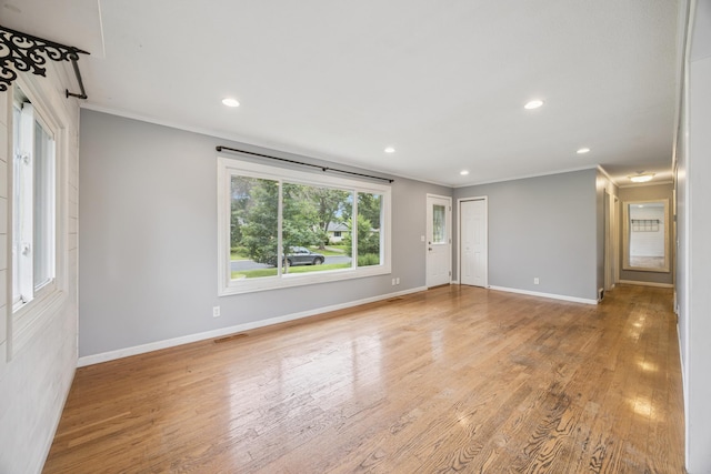 12209 Davenport St NE, Blaine, MN 55449 - empty room featuring crown molding, wood finished floors, and recessed lighting