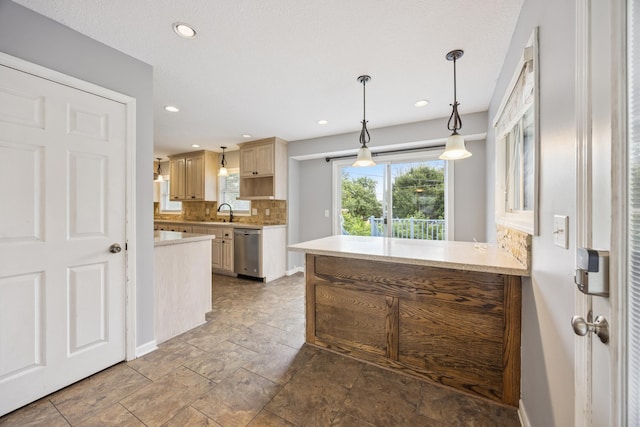 12209 Davenport St NE, Blaine, MN 55449 - kitchen featuring stainless steel dishwasher, tasteful backsplash, light countertops, recessed lighting, and pendant lighting