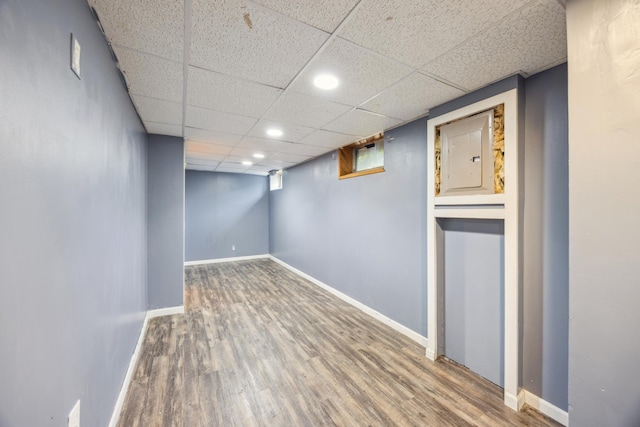 12209 Davenport St NE, Blaine, MN 55449 - basement featuring wood finished floors, a drop ceiling, and recessed lighting