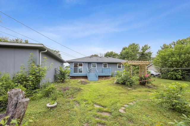 12209 Davenport St NE, Blaine, MN 55449 - rear view of house featuring a deck and a lawn