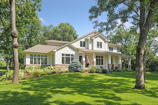 2 Red Forest Ln, North Oaks, MN 55127 - view of front of property with a front lawn, a porch, stone siding, and a shingled roof
