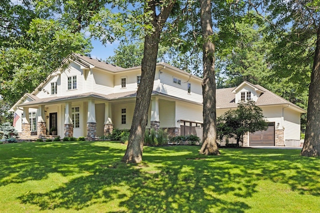 2 Red Forest Ln, North Oaks, MN 55127 - view of front of property featuring stone siding, a front lawn, a garage, and a porch