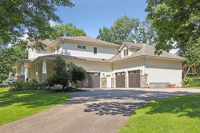 2 Red Forest Ln, North Oaks, MN 55127 - view of front facade with driveway, stone siding, a front lawn, and a shingled roof