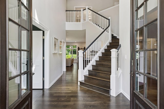 2 Red Forest Ln, North Oaks, MN 55127 - entryway with wood finished floors, a high ceiling, and stairs
