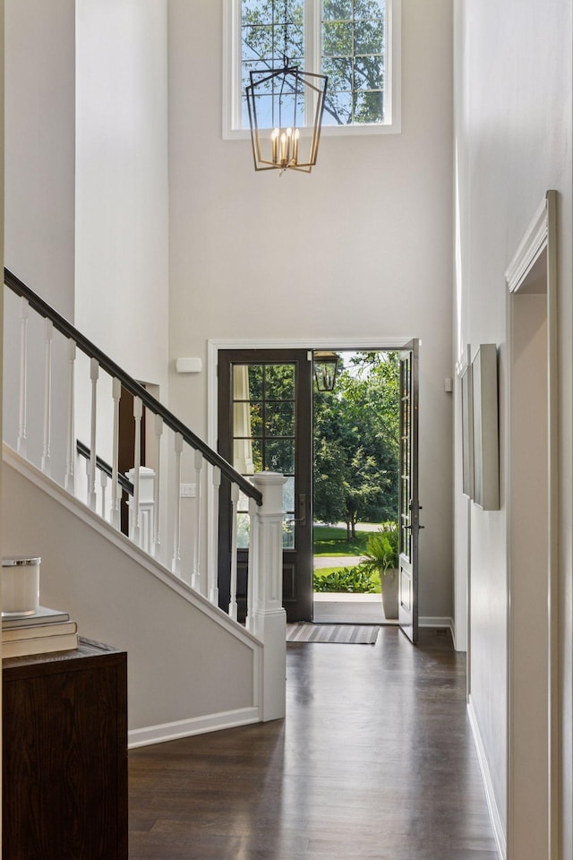 2 Red Forest Ln, North Oaks, MN 55127 - foyer entrance with a high ceiling, stairway, healthy amount of natural light, a chandelier, and wood finished floors