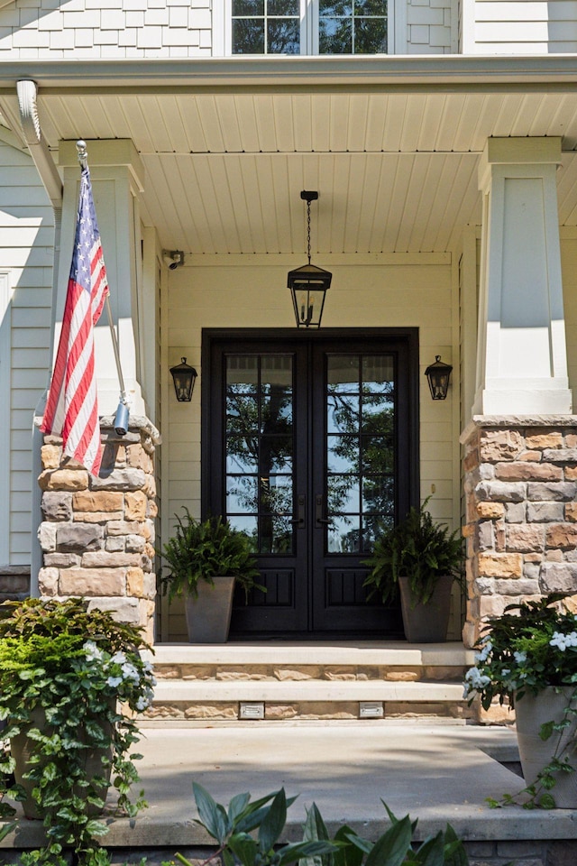 2 Red Forest Ln, North Oaks, MN 55127 - view of exterior entry with french doors and a porch