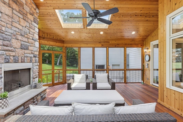 2 Red Forest Ln, North Oaks, MN 55127 - sunroom / solarium with a wooden deck, vaulted ceiling, hardwood / wood-style flooring, recessed lighting, and a skylight