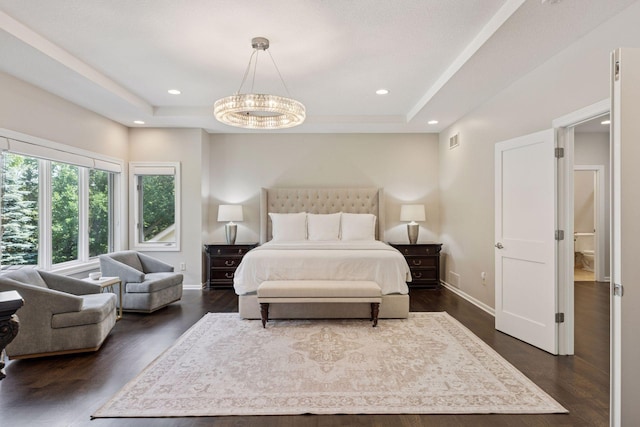 2 Red Forest Ln, North Oaks, MN 55127 - bedroom featuring a tray ceiling, dark wood-type flooring, a chandelier, and recessed lighting
