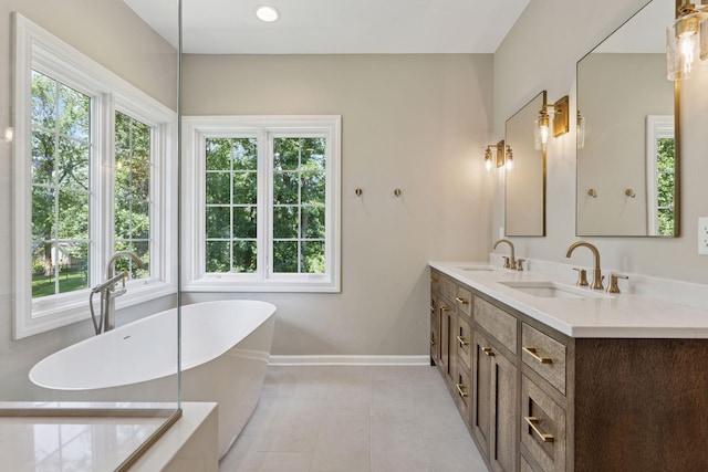 2 Red Forest Ln, North Oaks, MN 55127 - full bath with plenty of natural light, a freestanding tub, double vanity, and tile patterned floors