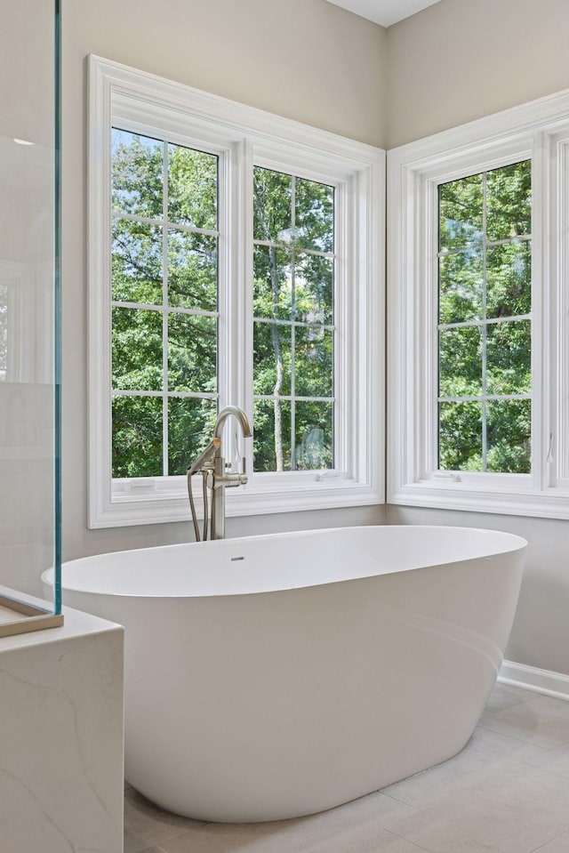 2 Red Forest Ln, North Oaks, MN 55127 - bathroom with a freestanding bath and plenty of natural light