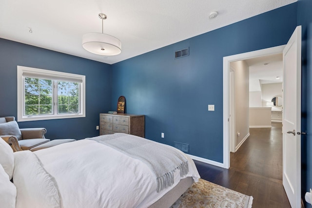 2 Red Forest Ln, North Oaks, MN 55127 - bedroom with dark wood-style flooring and baseboards