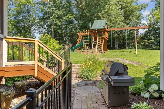 2 Red Forest Ln, North Oaks, MN 55127 - view of patio featuring grilling area, a playground, and view of scattered trees