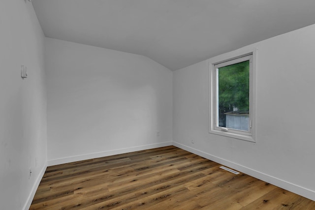 12 16th Ave N, Saint Cloud, MN 56303 - spare room with vaulted ceiling and wood finished floors