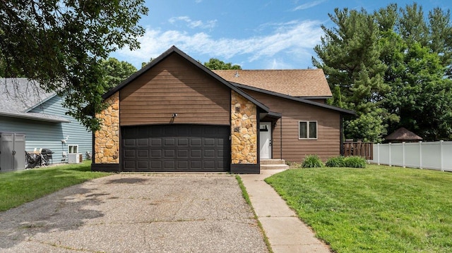337 9 1/2 St N, Sauk Rapids, MN 56379 - view of front of property featuring stone siding, driveway, a garage, and roof with shingles