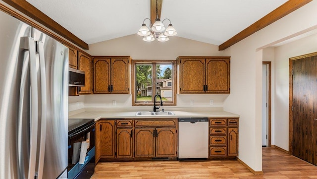 337 9 1/2 St N, Sauk Rapids, MN 56379 - kitchen featuring stainless steel appliances, brown cabinetry, and light wood finished floors