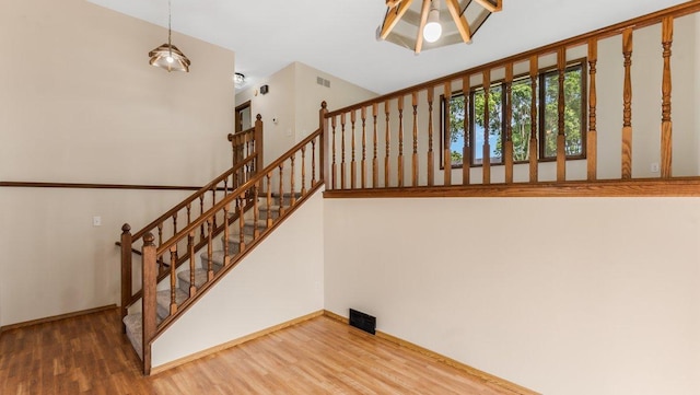 337 9 1/2 St N, Sauk Rapids, MN 56379 - staircase with wood finished floors and baseboards