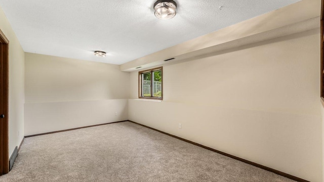 337 9 1/2 St N, Sauk Rapids, MN 56379 - carpeted spare room with baseboards and a textured ceiling