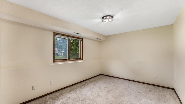 337 9 1/2 St N, Sauk Rapids, MN 56379 - carpeted empty room featuring baseboards and a textured ceiling