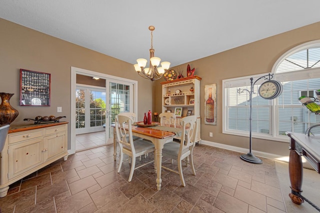 1904 Rock Ridge Ln, Saint Peter, MN 56082 - dining room with a chandelier and stone tile flooring