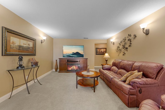 1904 Rock Ridge Ln, Saint Peter, MN 56082 - living area featuring light colored carpet and a glass covered fireplace