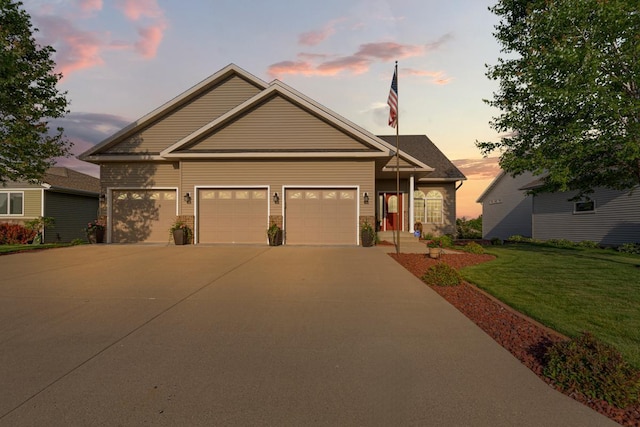 1904 Rock Ridge Ln, Saint Peter, MN 56082 - view of front facade with a lawn, driveway, and an attached garage