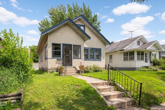 3809 41st Ave S, Minneapolis, MN 55406 - bungalow featuring stucco siding and a front yard