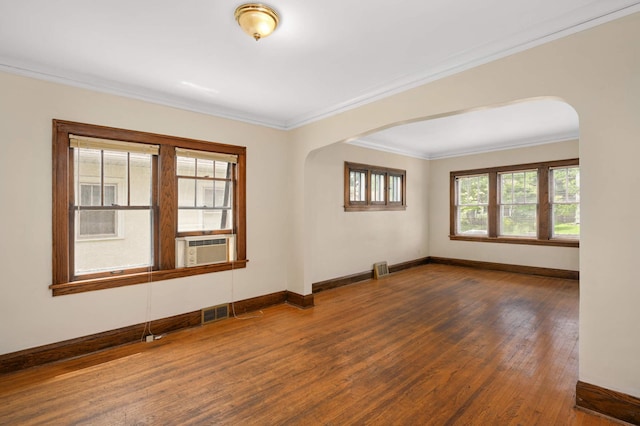 3809 41st Ave S, Minneapolis, MN 55406 - unfurnished room with arched walkways, wood finished floors, and ornamental molding