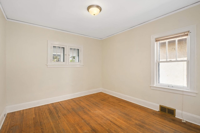 3809 41st Ave S, Minneapolis, MN 55406 - empty room with crown molding and wood finished floors
