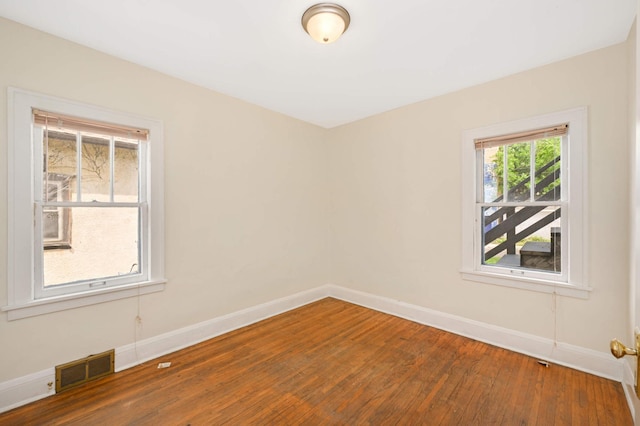 3809 41st Ave S, Minneapolis, MN 55406 - empty room featuring baseboards and wood finished floors