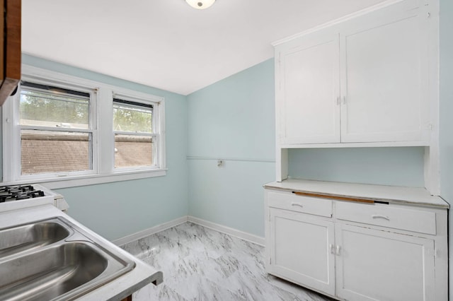3809 41st Ave S, Minneapolis, MN 55406 - laundry room with light marble finish floors and baseboards