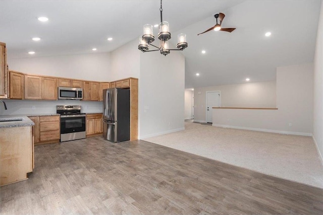 S1546 Shawnee Dr Unit B, Alma, WI 54610 - kitchen with appliances with stainless steel finishes, open floor plan, light countertops, a chandelier, and decorative light fixtures