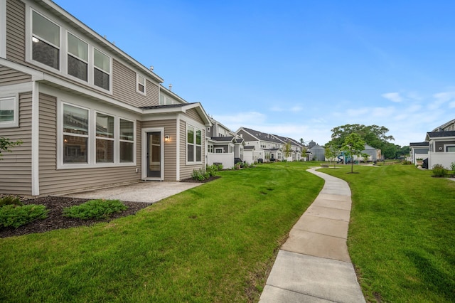 2570 Paddock Path, Shakopee, MN 55379 - view of green lawn featuring a patio and a residential view