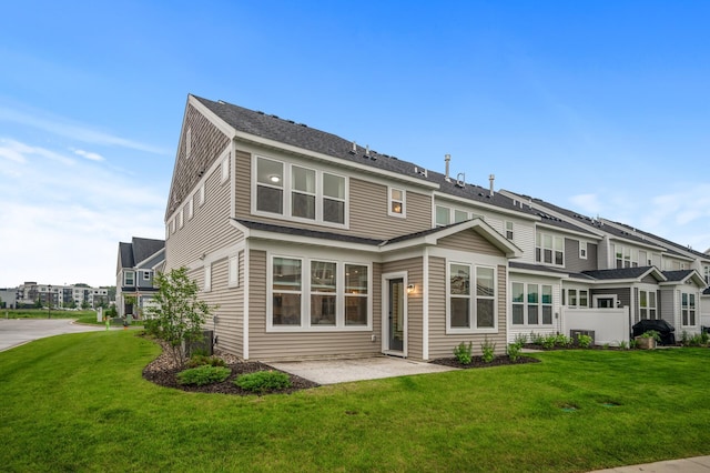 2570 Paddock Path, Shakopee, MN 55379 - back of house featuring a lawn and a patio area