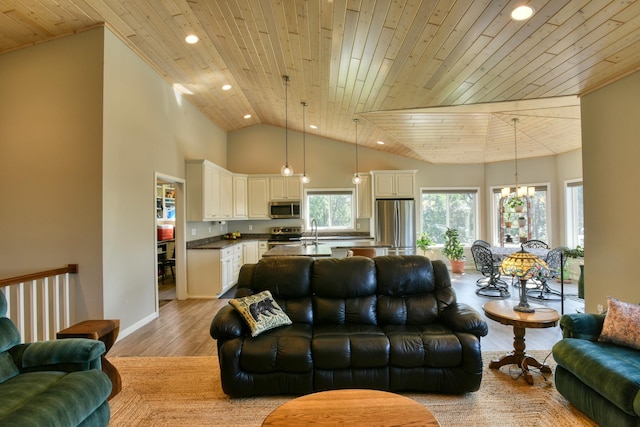 30534 County Highway 12, Dalton, MN 56324 - living room with wooden ceiling, light wood-style floors, recessed lighting, high vaulted ceiling, and a chandelier