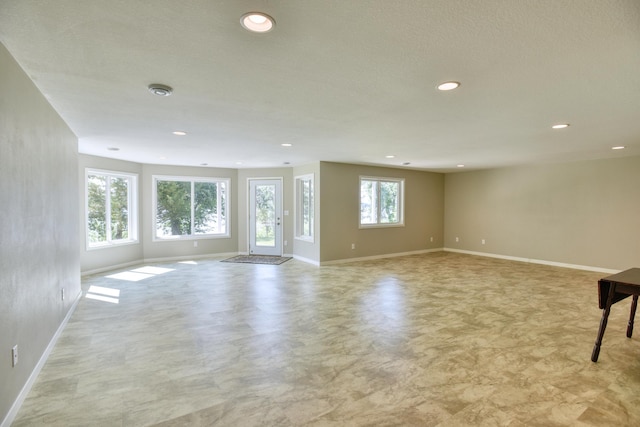 30534 County Highway 12, Dalton, MN 56324 - unfurnished living room featuring baseboards and recessed lighting