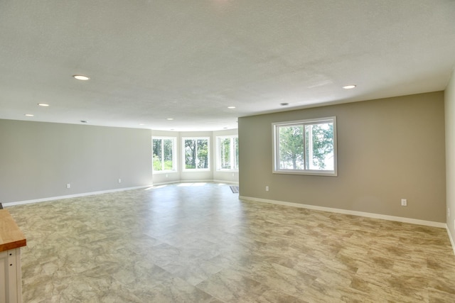 30534 County Highway 12, Dalton, MN 56324 - unfurnished room with recessed lighting, a textured ceiling, and light flooring