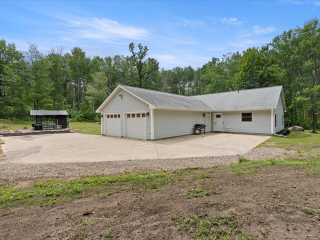 6629 45th Ave SW, Moose Lake Twp, MN 56472 - view of side of home with a detached garage