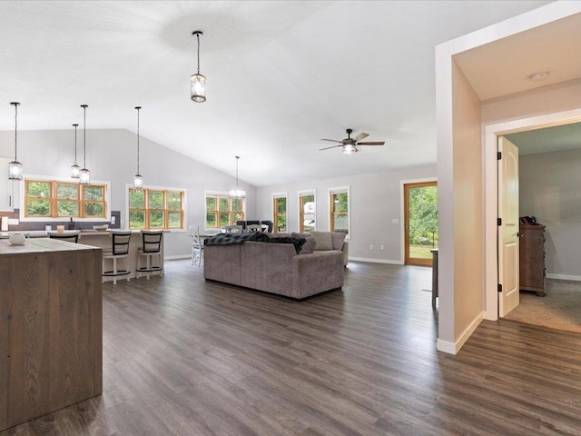 6629 45th Ave SW, Moose Lake Twp, MN 56472 - living room with vaulted ceiling, healthy amount of natural light, dark wood-style floors, and a ceiling fan