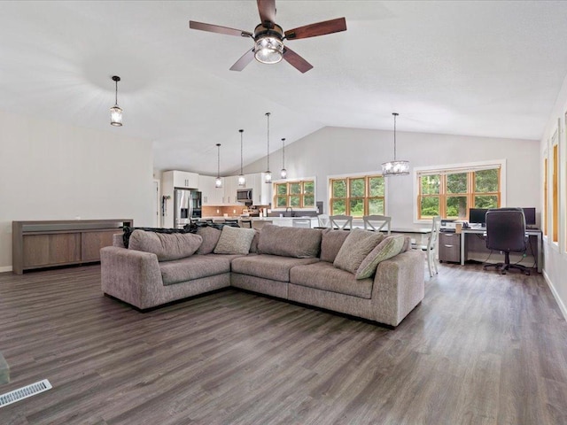 6629 45th Ave SW, Moose Lake Twp, MN 56472 - living area with dark wood finished floors, lofted ceiling, ceiling fan, an office area, and a chandelier