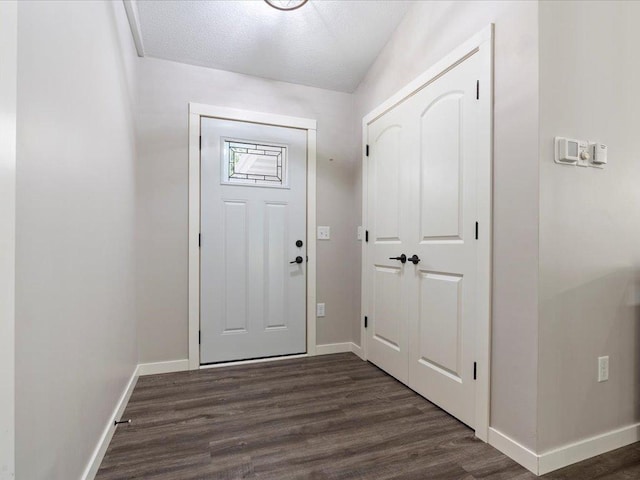 6629 45th Ave SW, Moose Lake Twp, MN 56472 - entrance foyer with dark wood-style flooring and a textured ceiling