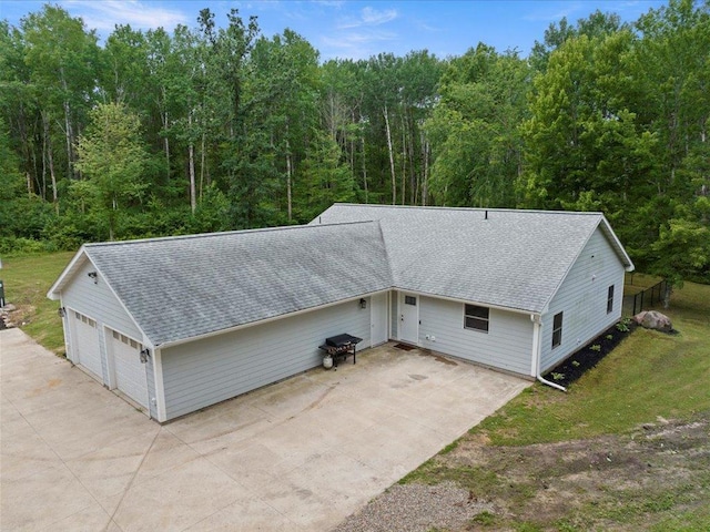 6629 45th Ave SW, Moose Lake Twp, MN 56472 - detached garage with a wooded view