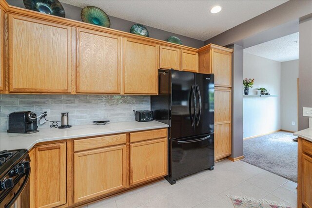 4363 Victor Path Unit 7, Hugo, MN 55038 - kitchen featuring black appliances, light colored carpet, light countertops, backsplash, and a textured ceiling