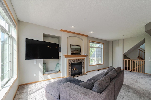 4363 Victor Path Unit 7, Hugo, MN 55038 - carpeted living area with a fireplace, stairway, and recessed lighting