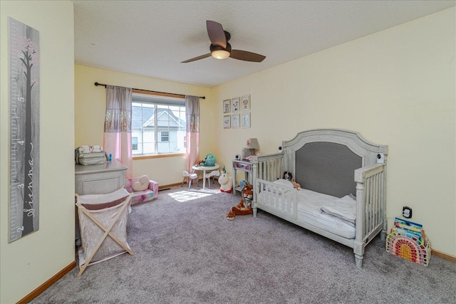 4363 Victor Path Unit 7, Hugo, MN 55038 - bedroom with carpet, a ceiling fan, a crib, and a textured ceiling