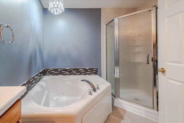 4363 Victor Path Unit 7, Hugo, MN 55038 - full bathroom with a shower stall, a jetted tub, tile patterned floors, and vanity