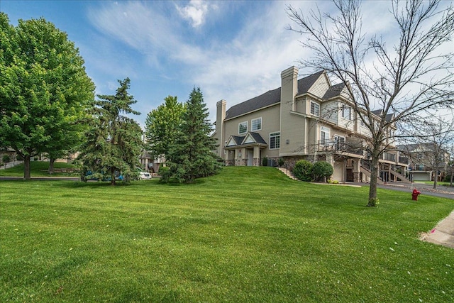 4363 Victor Path Unit 7, Hugo, MN 55038 - view of property exterior featuring a yard and a chimney